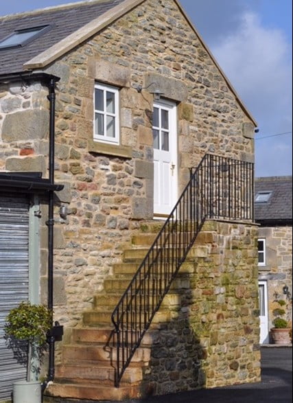 Your tiny private patio and stairs, there is a garden too.