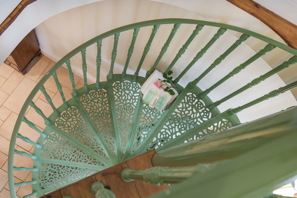 The beautiful wrought iron spiral staircase.
